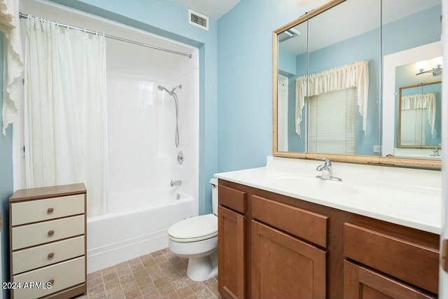 full bathroom with shower / bath combo, toilet, and vanity