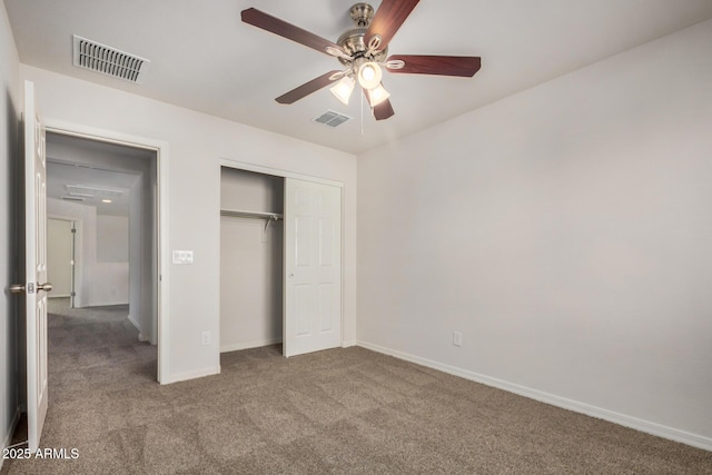 unfurnished bedroom with visible vents, baseboards, carpet flooring, and a closet