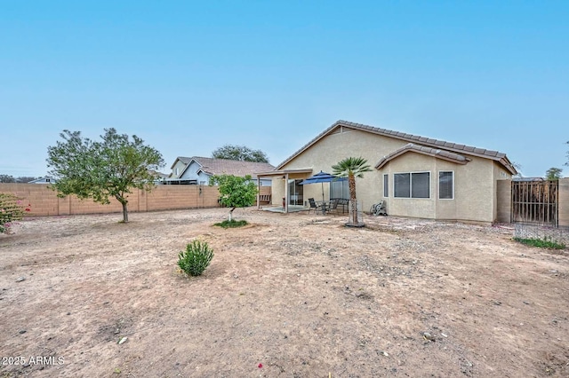 rear view of property with a patio area