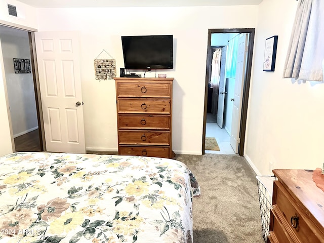 bedroom with light colored carpet