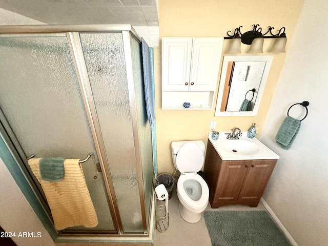 bathroom featuring vanity, toilet, and walk in shower