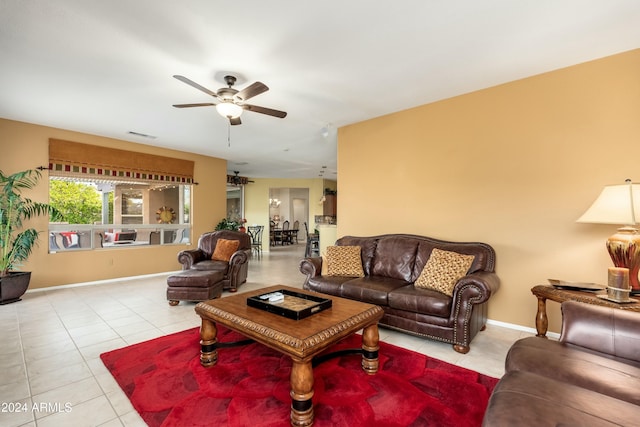 tiled living room featuring ceiling fan