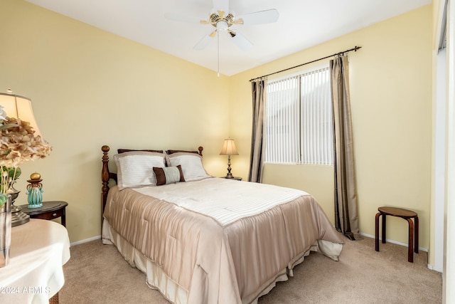 bedroom with ceiling fan and light colored carpet