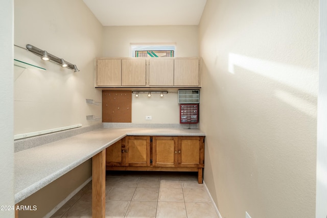 kitchen with light tile patterned flooring