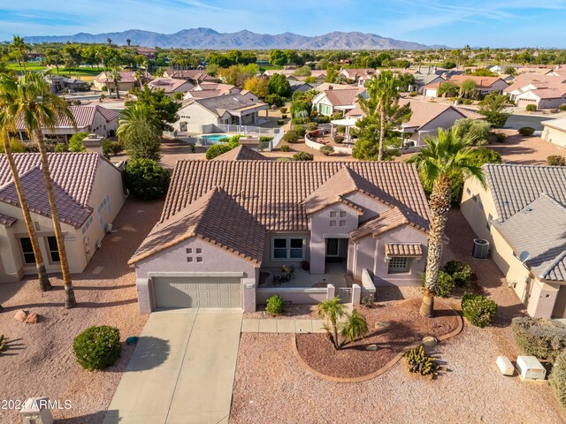 birds eye view of property with a mountain view