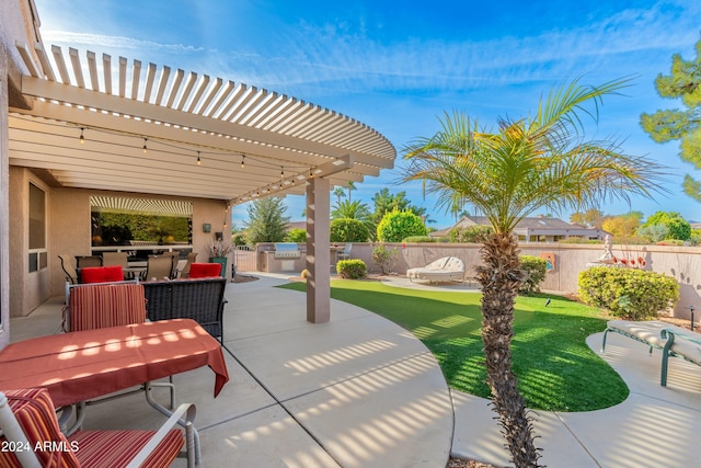 view of patio / terrace with a pergola and area for grilling