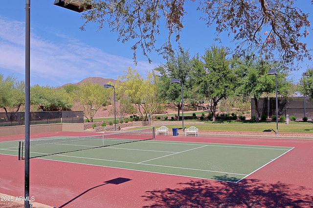 view of tennis court with a mountain view and basketball court