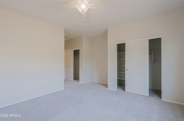 unfurnished bedroom with ceiling fan and light carpet