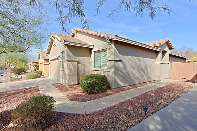 view of side of property with a garage