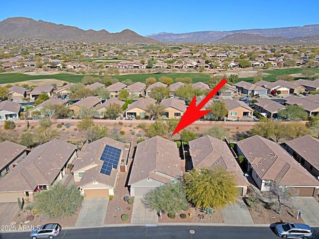 drone / aerial view featuring a mountain view