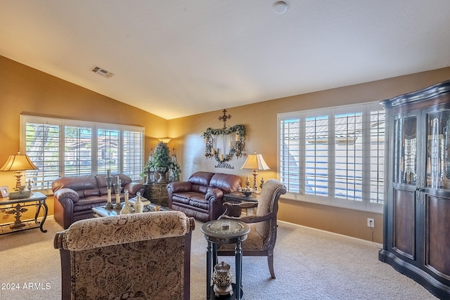 living room with light colored carpet and lofted ceiling