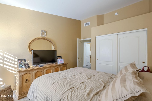 carpeted bedroom featuring a closet