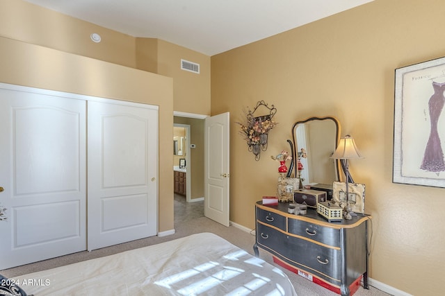 carpeted bedroom featuring a closet