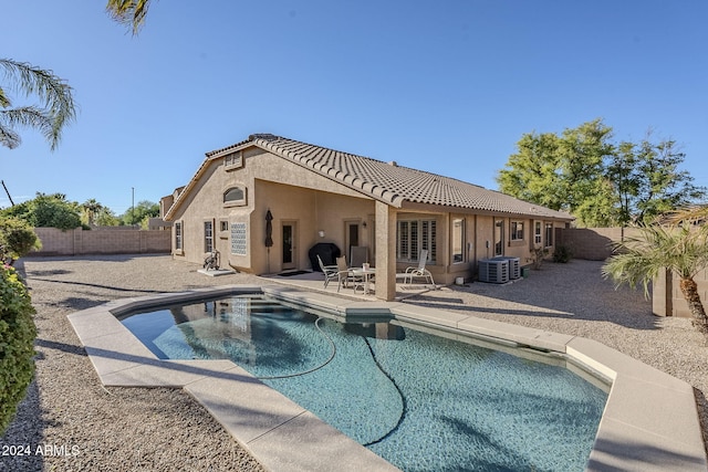 view of swimming pool with central AC and a patio area