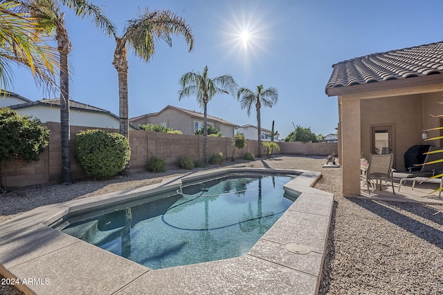 view of swimming pool with a patio area