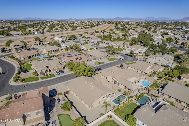 birds eye view of property featuring a mountain view