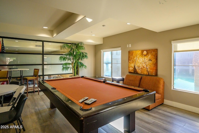 recreation room featuring wood-type flooring, plenty of natural light, and pool table