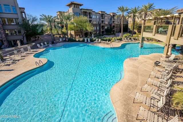 view of pool featuring a patio