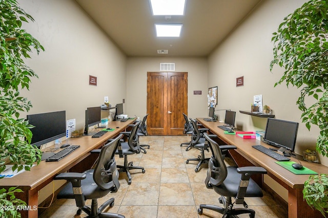 office with light tile patterned floors