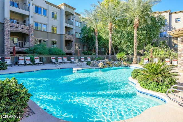 view of swimming pool featuring pool water feature