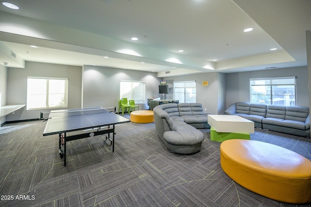 game room featuring dark carpet and a wealth of natural light