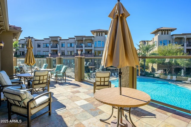 view of patio / terrace featuring a community pool