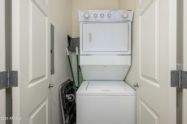 washroom with stacked washer / drying machine