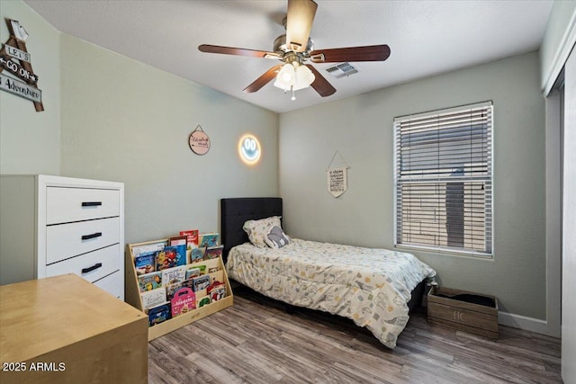 bedroom featuring ceiling fan and wood-type flooring