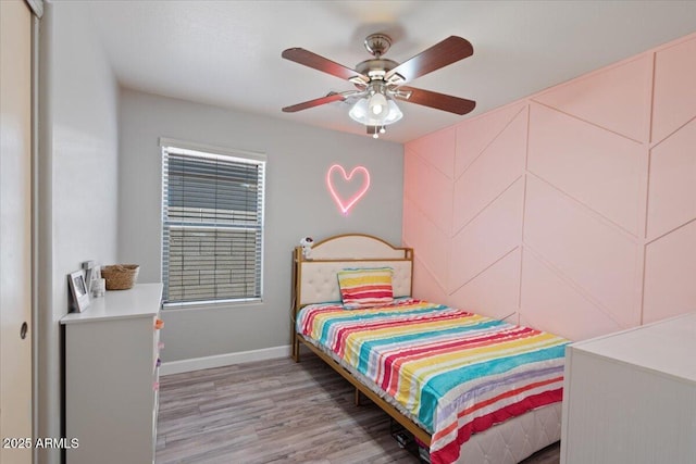 bedroom featuring ceiling fan and light wood-type flooring