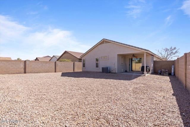 back of property featuring cooling unit, ceiling fan, and a patio area