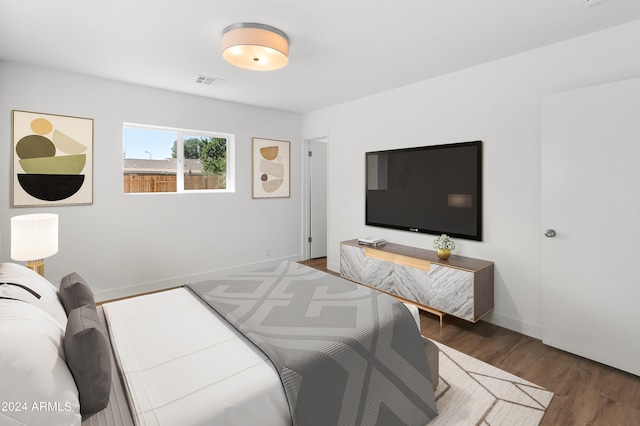 bedroom featuring dark hardwood / wood-style floors