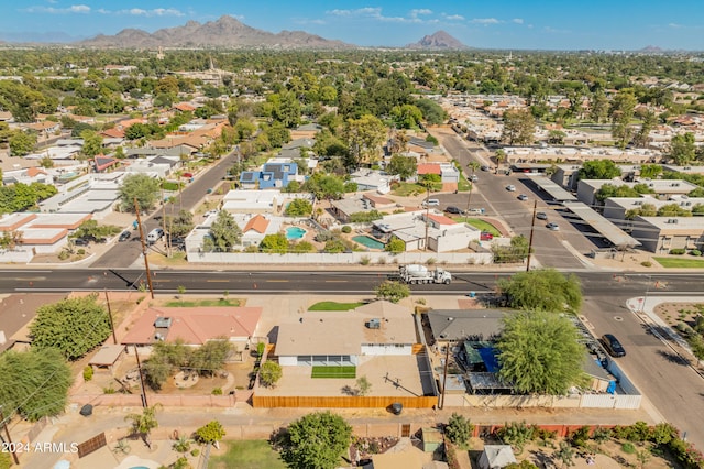 birds eye view of property with a mountain view