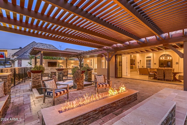 patio terrace at dusk with a pergola and an outdoor living space with a fire pit