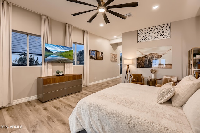 bedroom with hardwood / wood-style floors and ceiling fan