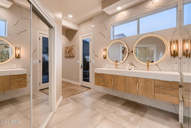 bathroom with vanity and a wealth of natural light