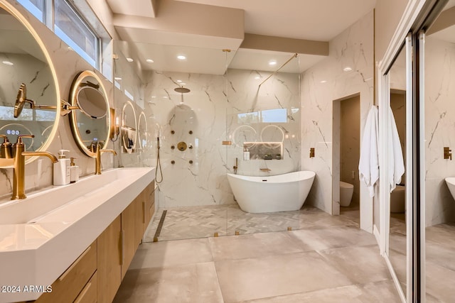 bathroom with vanity, shower with separate bathtub, and tile walls