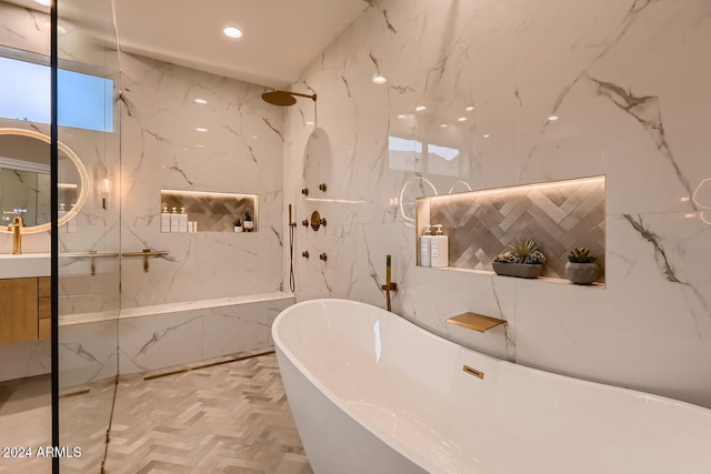 bathroom with parquet flooring, vanity, tile walls, and shower with separate bathtub