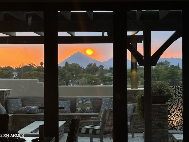 doorway to outside with a mountain view