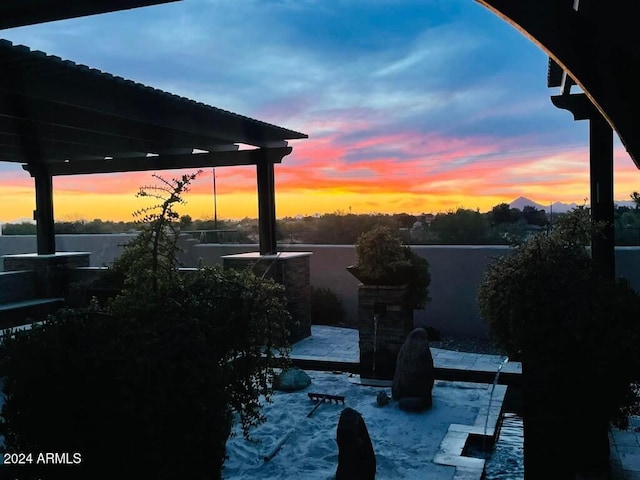 view of patio terrace at dusk