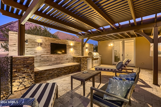 view of patio / terrace featuring outdoor lounge area, a pergola, an outdoor kitchen, and grilling area