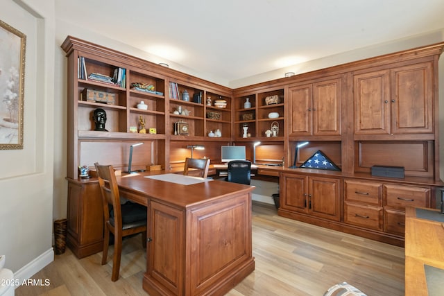 office space with light hardwood / wood-style floors