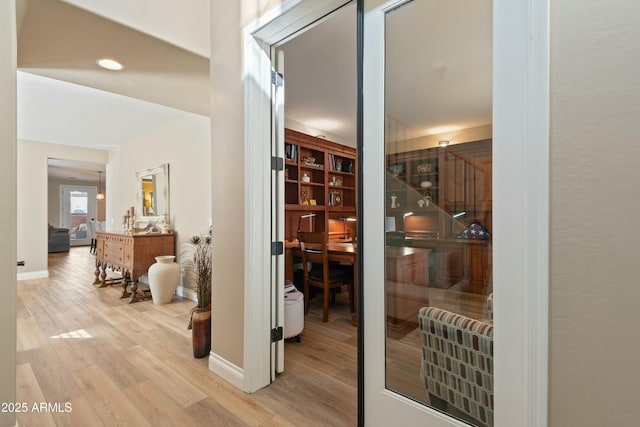 wine area with light wood-type flooring