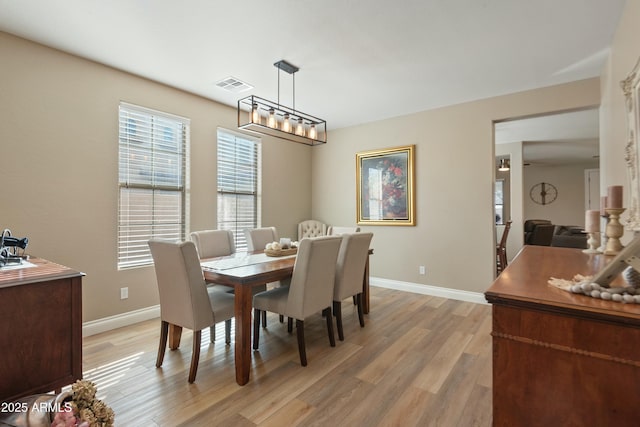 dining room with light wood-type flooring