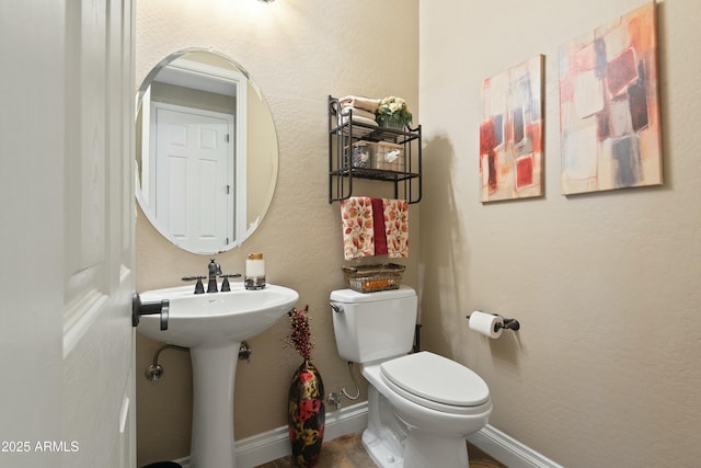 bathroom with sink and toilet