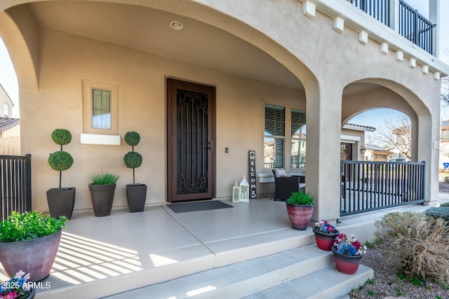 entrance to property featuring a porch