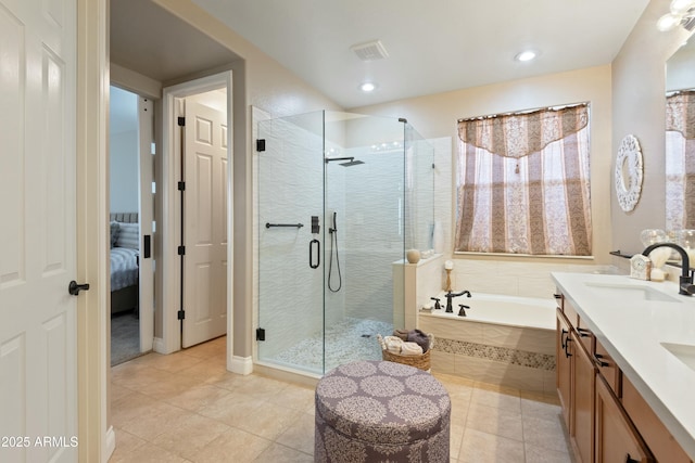 bathroom featuring tile patterned floors, vanity, and plus walk in shower