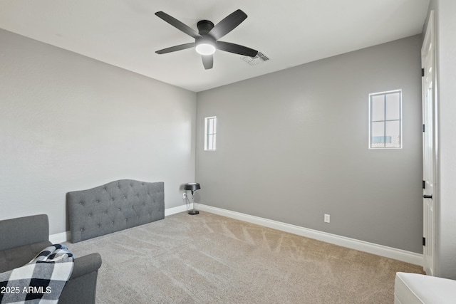 unfurnished room with carpet and ceiling fan