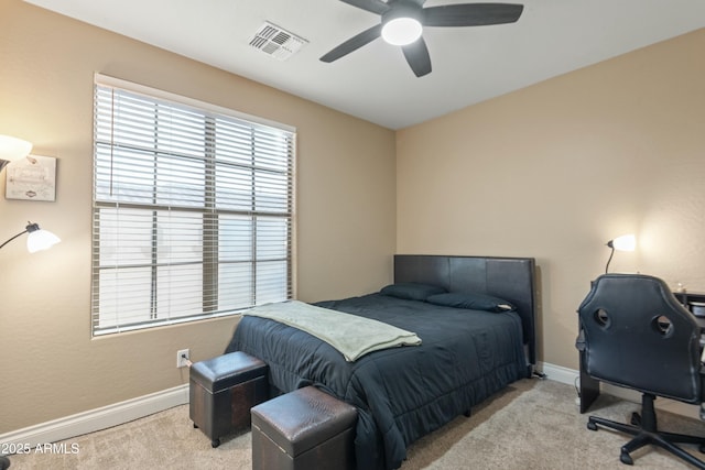 bedroom with ceiling fan and light colored carpet