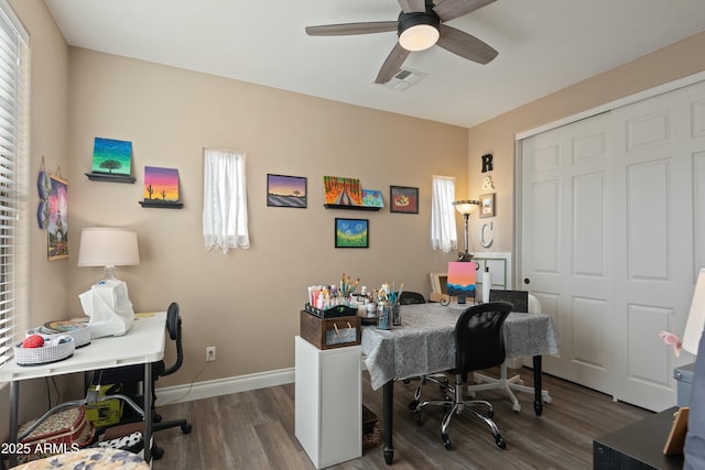 home office featuring dark hardwood / wood-style floors and ceiling fan