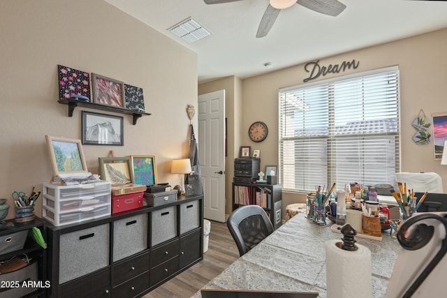 office space with hardwood / wood-style floors and ceiling fan